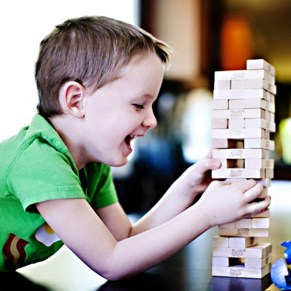 boy-playing-a-game-and-laughing_t20_X2N1X6